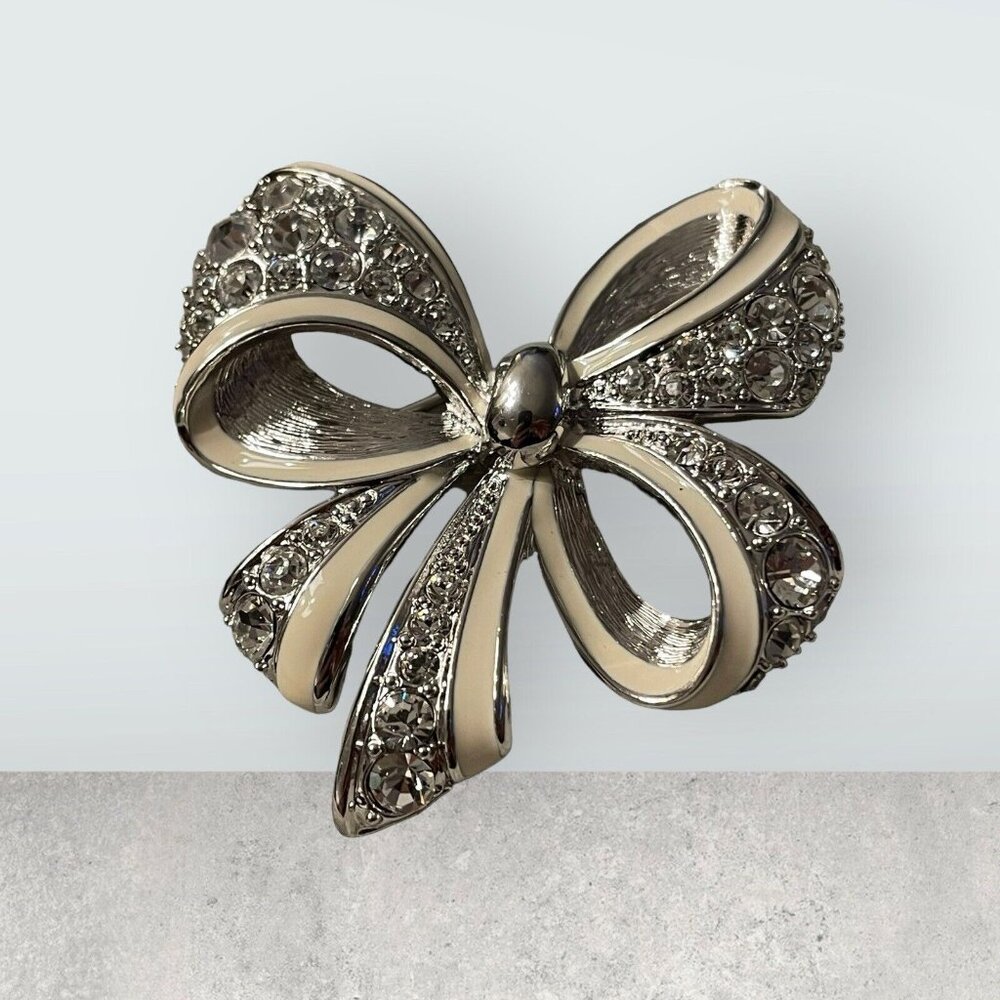 VTG‎ NOLAN MILLER Silver-Tone Icy Rhinestone White Enamel Ribbon Bow Pin Brooch